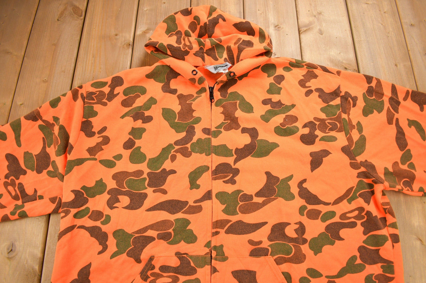 Vintage 1990s Moleskins Orange Camo Graphic Hoodie Men's 2XL from propervintagecanada