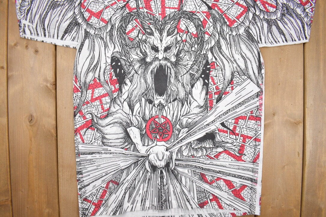 Vintage 1990s Morbid Rags Demon Graphic All Over Print T-Shirt Men's Large from propervintagecanada