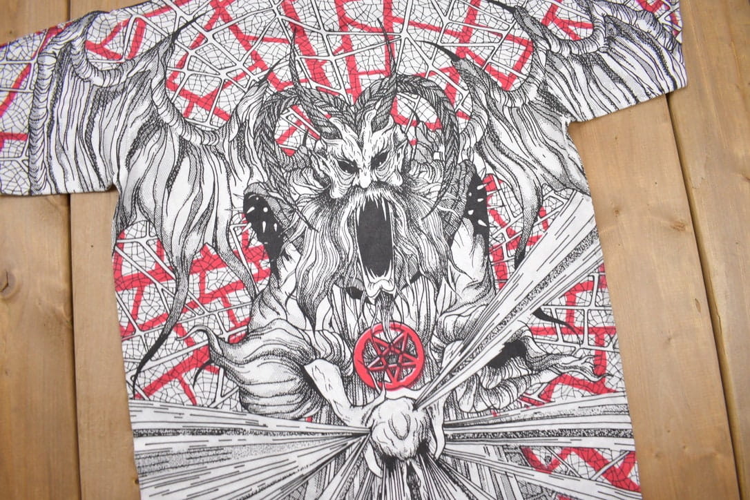 Vintage 1990s Morbid Rags Demon Graphic All Over Print T-Shirt Men's Large from propervintagecanada