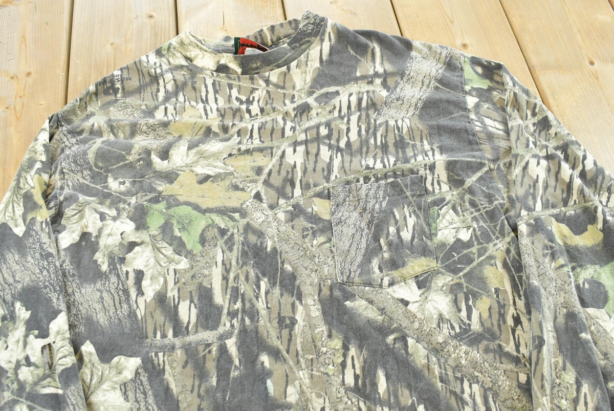 Vintage 1990s Mossy Oak Breakup Camo Long Sleeve T-Shirt Men's L from propervintagecanada