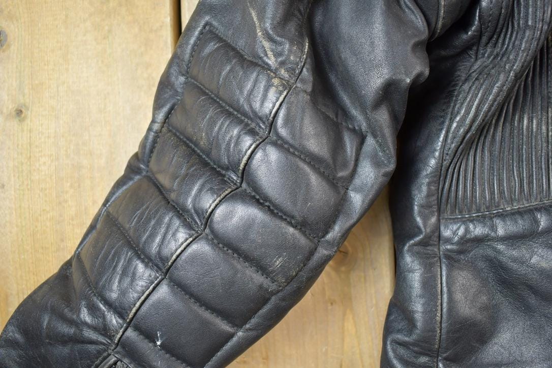 Vintage 1990s Motorcycle Leather Heavy Padded Biker Jacket Made In USA from propervintagecanada