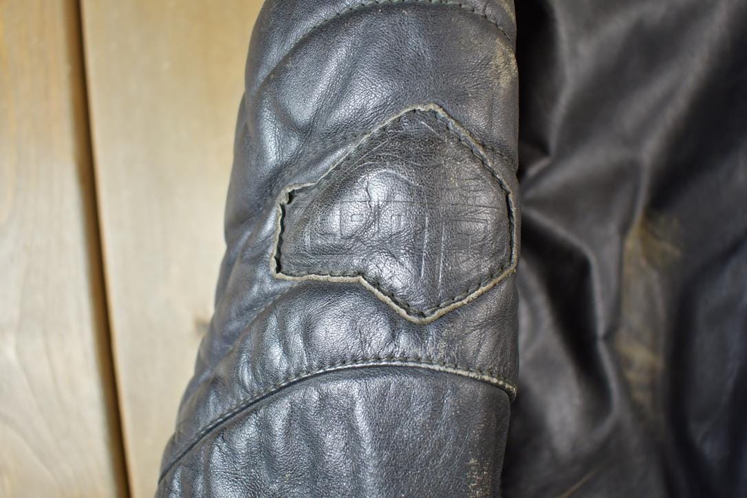 Vintage 1990s Motorcycle Leather Heavy Padded Biker Jacket Made In USA from propervintagecanada