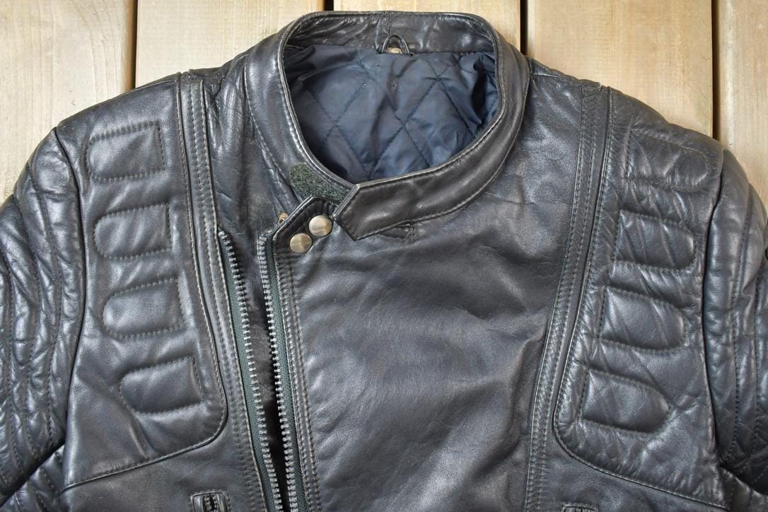 Vintage 1990s Motorcycle Leather Heavy Padded Biker Jacket Made In USA from propervintagecanada