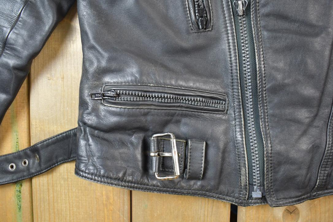 Vintage 1990s Motorcycle Leather Heavy Padded Biker Jacket Made In USA from propervintagecanada