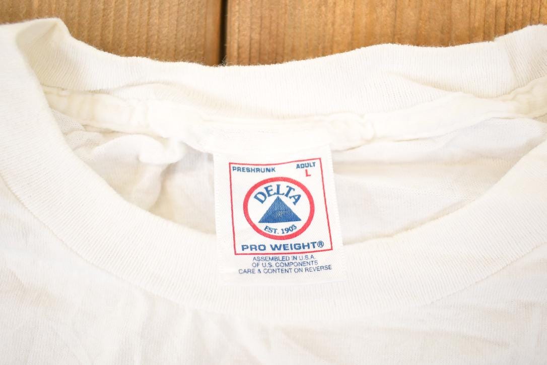 Vintage 1990s Napa Delta Champion Spark Plugs Souvenir Automotive T-Shirt Men's L from propervintagecanada