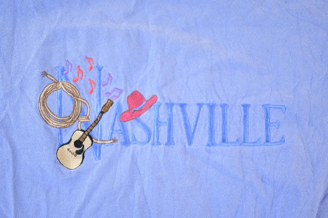 Vintage 1990s Nashville Souvenir Single Stitch Graphic Print T-Shirt Men's XL from propervintagecanada
