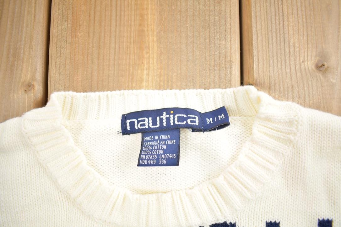 Vintage 1990s Nautica All Over Print Knit Crewneck Sweater Men's Medium from propervintagecanada