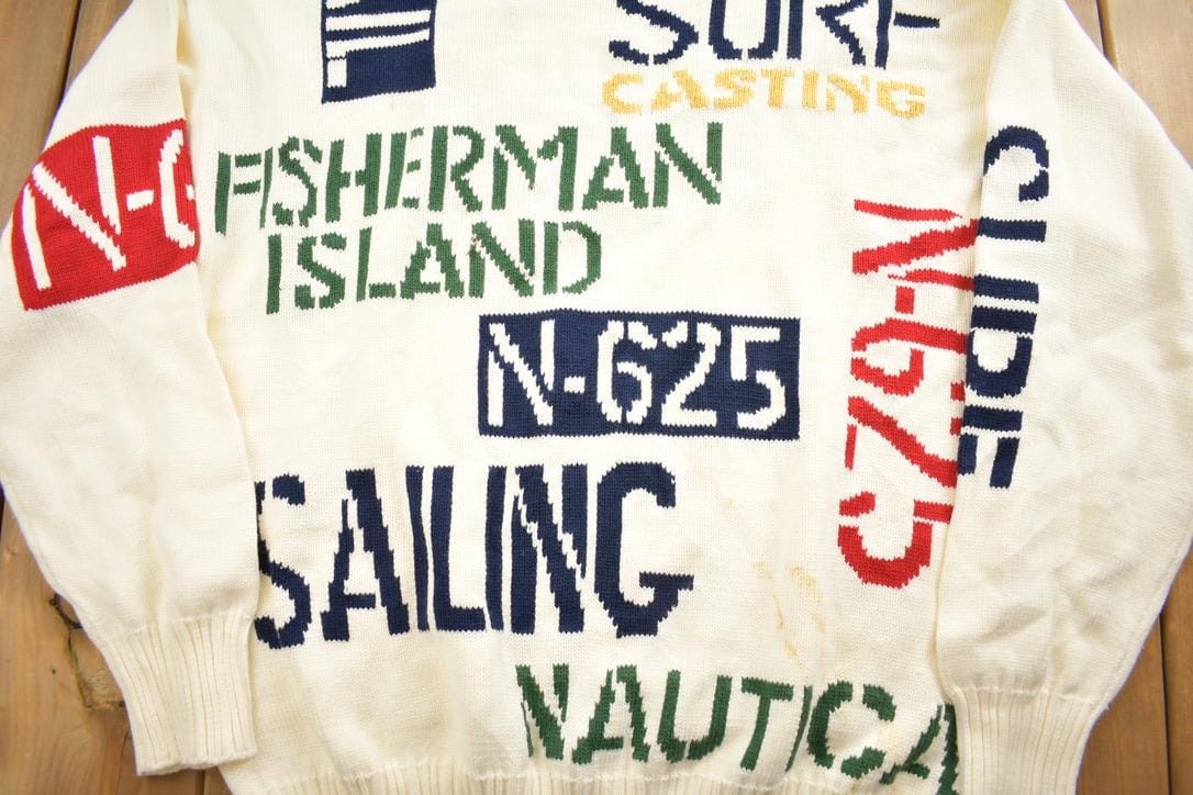 Vintage 1990s Nautica All Over Print Knit Crewneck Sweater Men's Medium from propervintagecanada