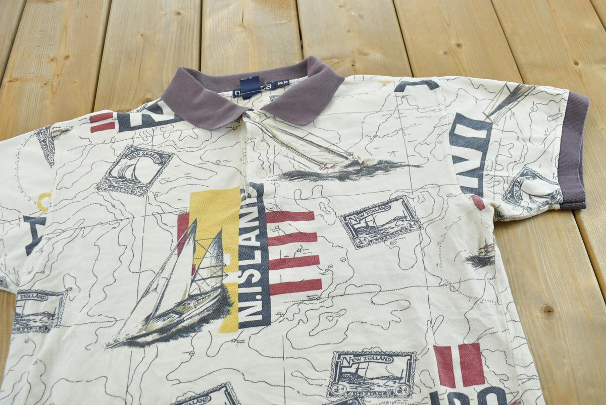 Vintage 1990s Nautica Map Print Polo Shirt Men's M from propervintagecanada