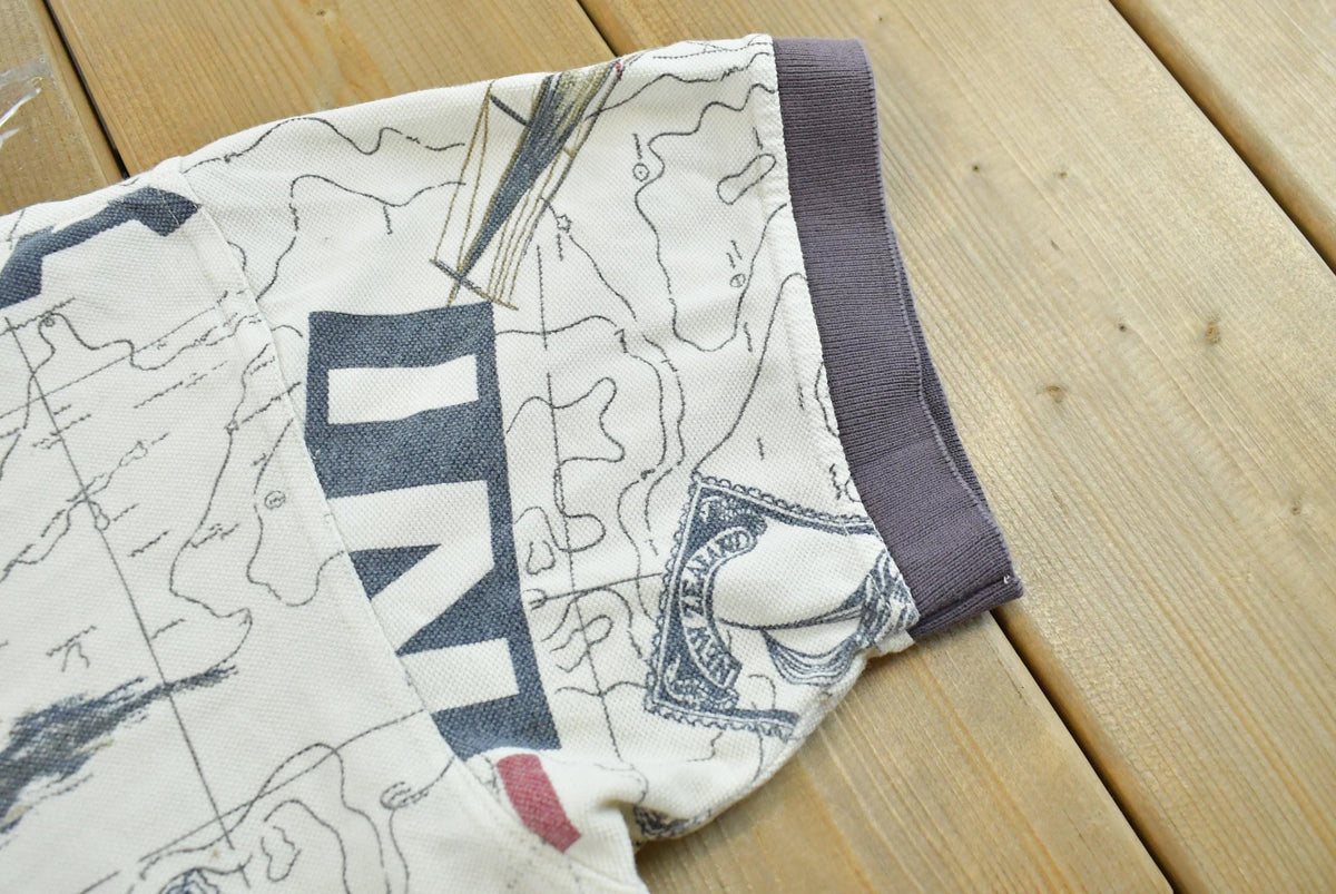 Vintage 1990s Nautica Map Print Polo Shirt Men's M from propervintagecanada