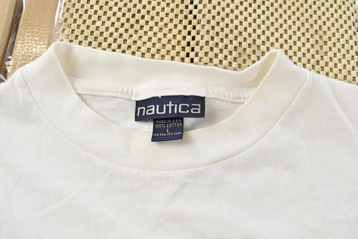 Vintage 1990s Nautica Rowing Oars Graphic T Shirt Men's L from propervintagecanada