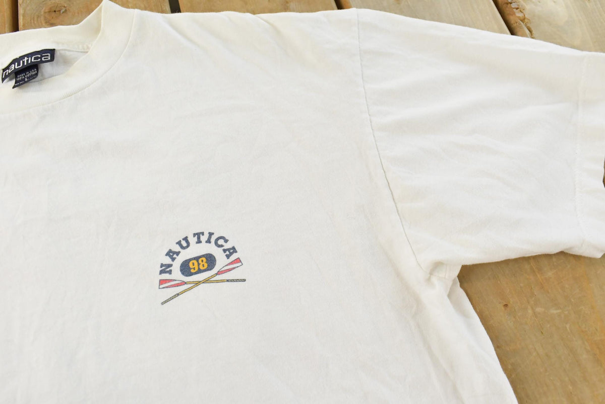 Vintage 1990s Nautica Rowing Oars Graphic T Shirt Men's L from propervintagecanada