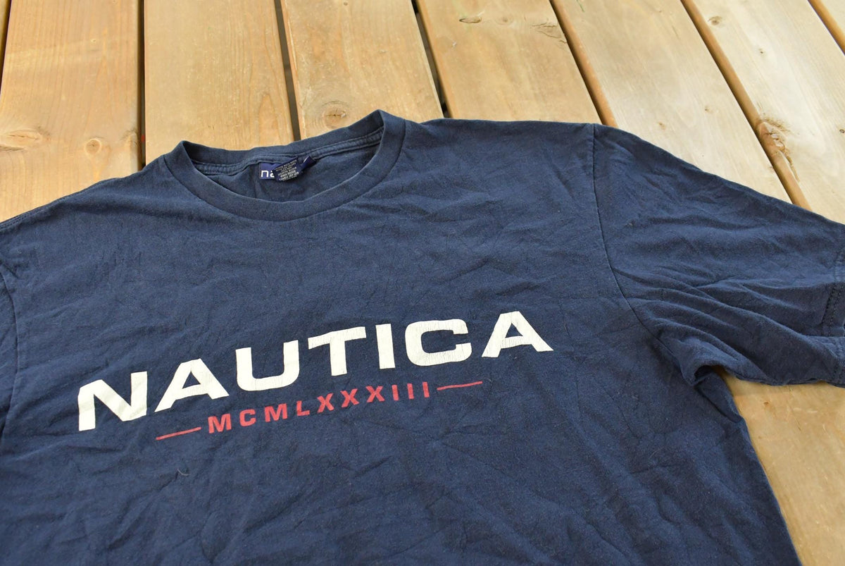 Vintage 1990s Nautica Spellout Graphic T Shirt Men's XL from propervintagecanada
