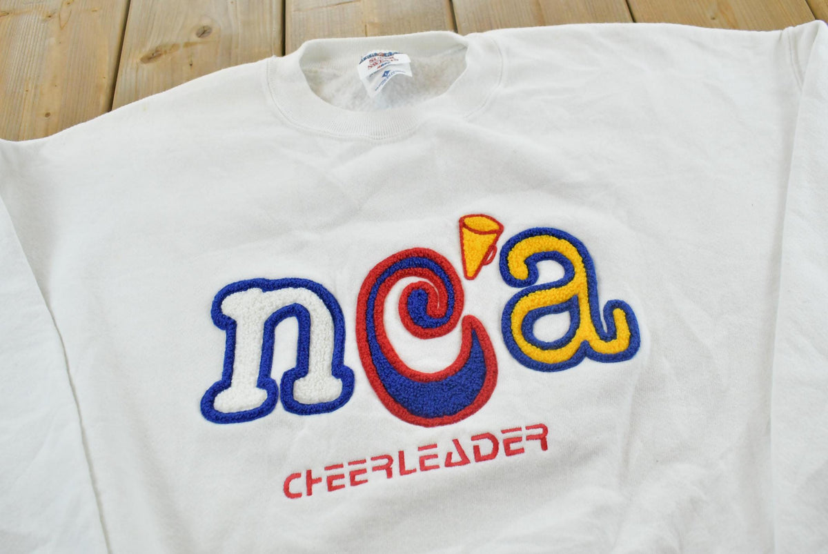 Vintage 1990s NCA Cheerleader Chenille Patch Embroidered Crewneck Sweatshirt Men's L / Made In USA / 90s Streetwear from propervintagecanada