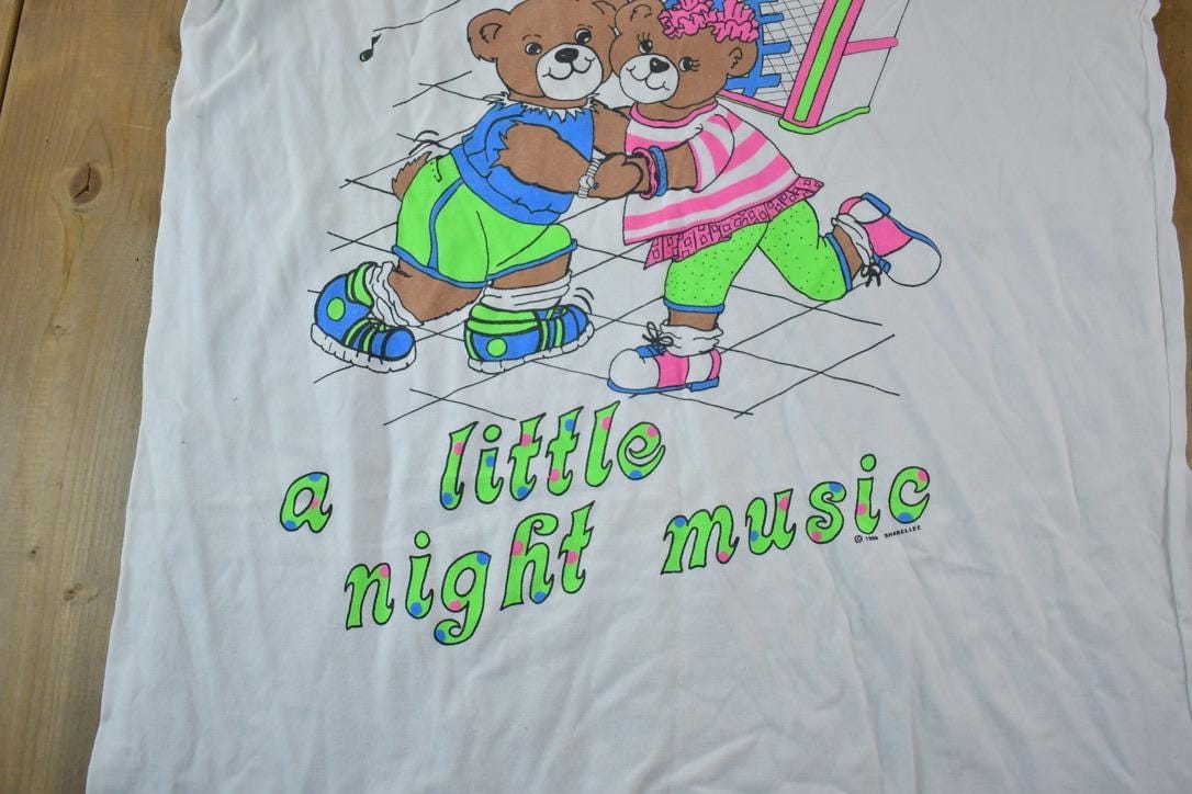 Vintage 1990s Neon Teddy Night Music Souvenir Single Stitch Graphic Print T-Shirt Men's 2XL from propervintagecanada