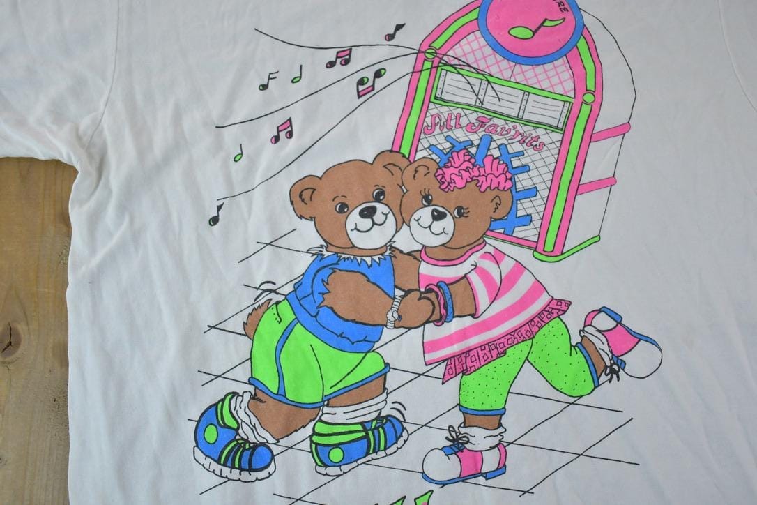 Vintage 1990s Neon Teddy Night Music Souvenir Single Stitch Graphic Print T-Shirt Men's 2XL from propervintagecanada