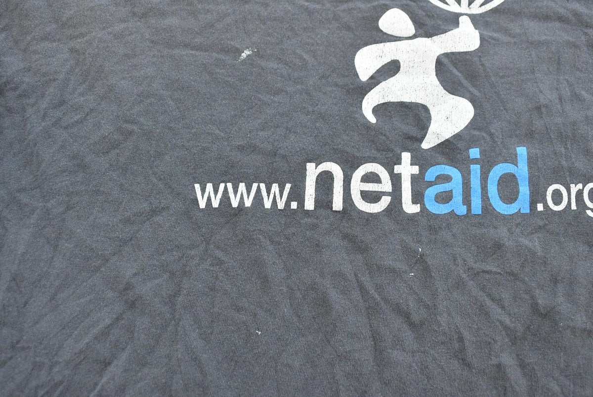 Vintage 1990s Netaid.org Charity Concert T-Shirt Mens XL from propervintagecanada