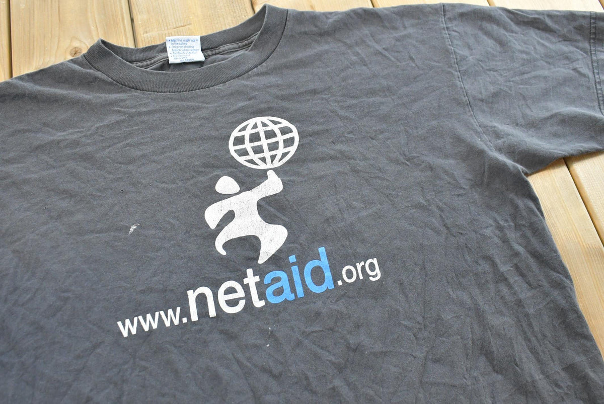Vintage 1990s Netaid.org Charity Concert T-Shirt Mens XL from propervintagecanada