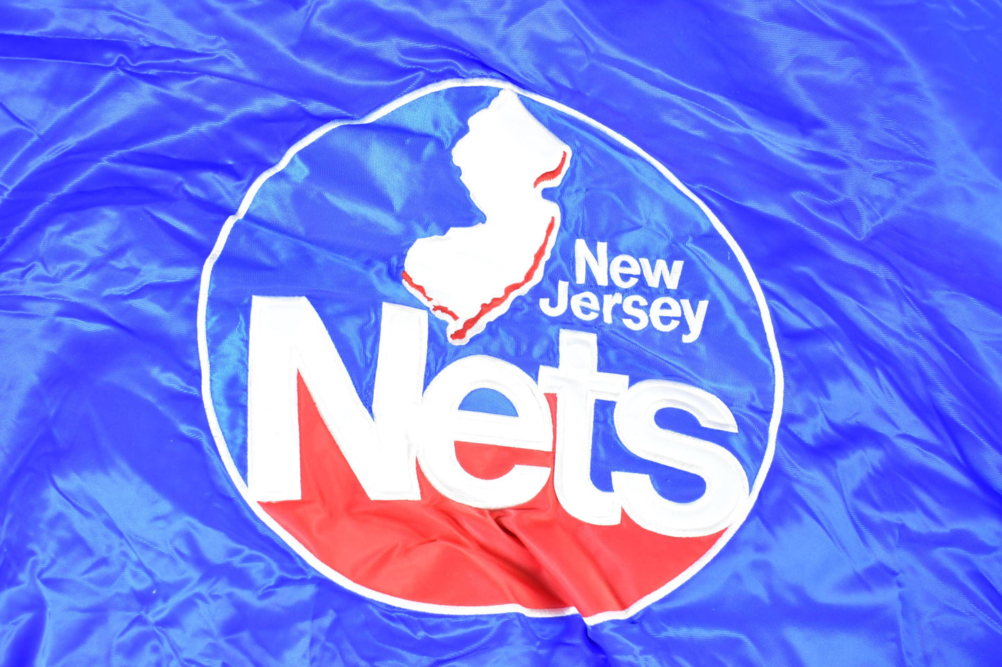 Vintage 1990s New Jersey Nets Hardwood Classics Satin Button Down Puffer Bomber Style NBA Basketball Jacket from propervintagecanada