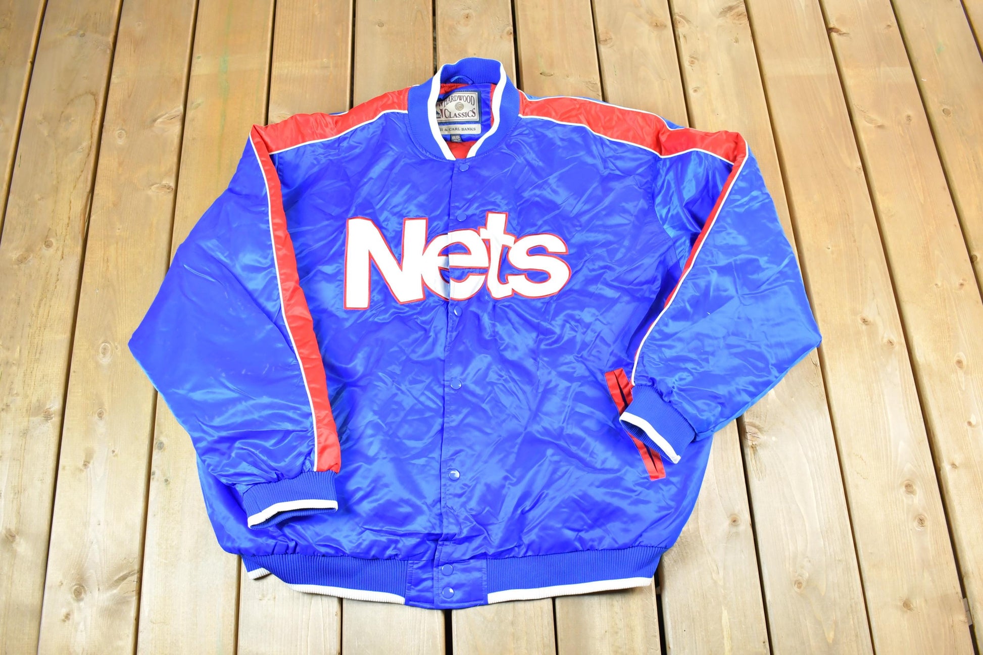 Vintage 1990s New Jersey Nets Hardwood Classics Satin Button Down Puffer Bomber Style NBA Basketball Jacket from propervintagecanada