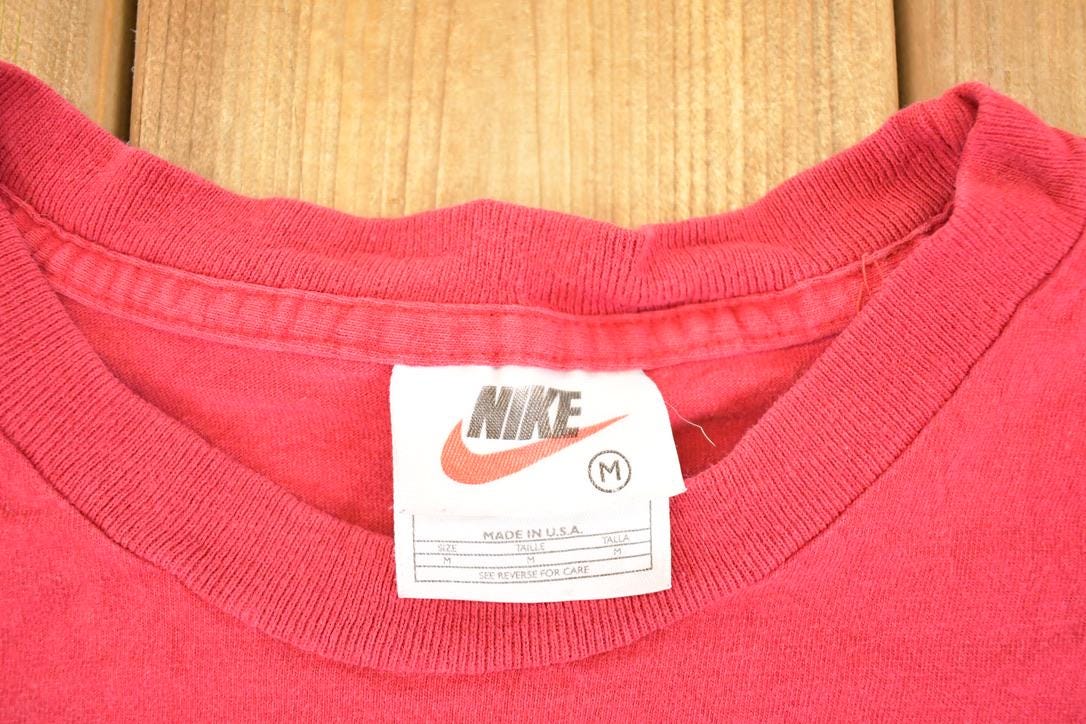 Vintage 1990s Nike Athletics T-Shirt Women's M from propervintagecanada
