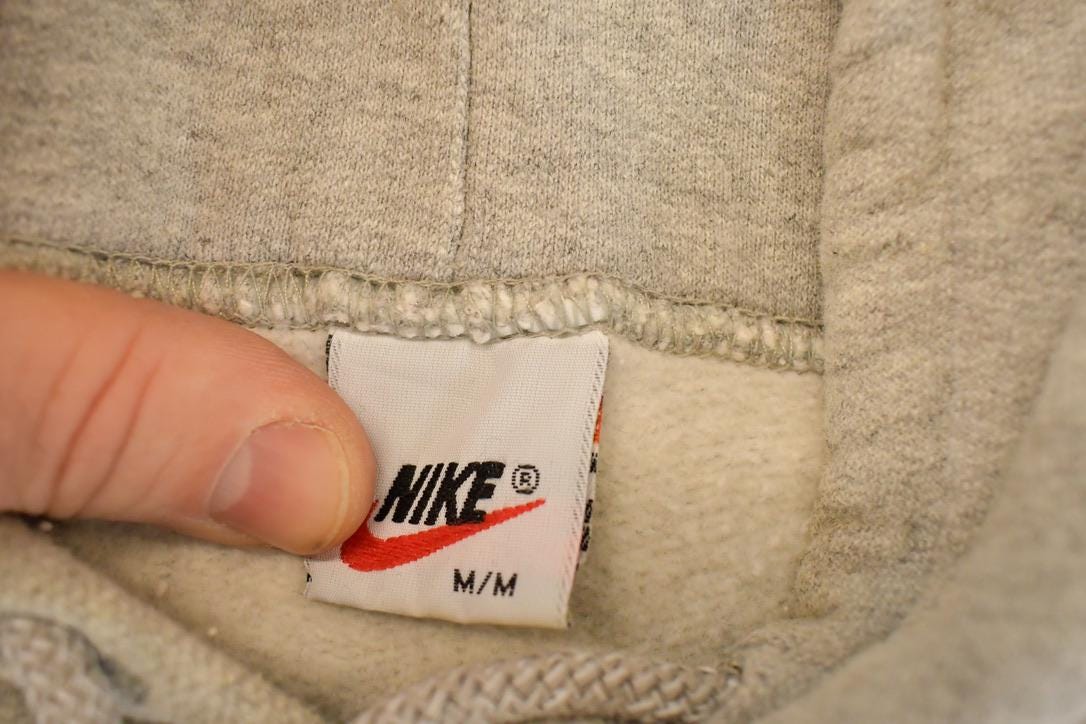 Vintage 1990s Nike Embroidered Mini Swoosh Hoodie Sweatshirt Men's L from propervintagecanada