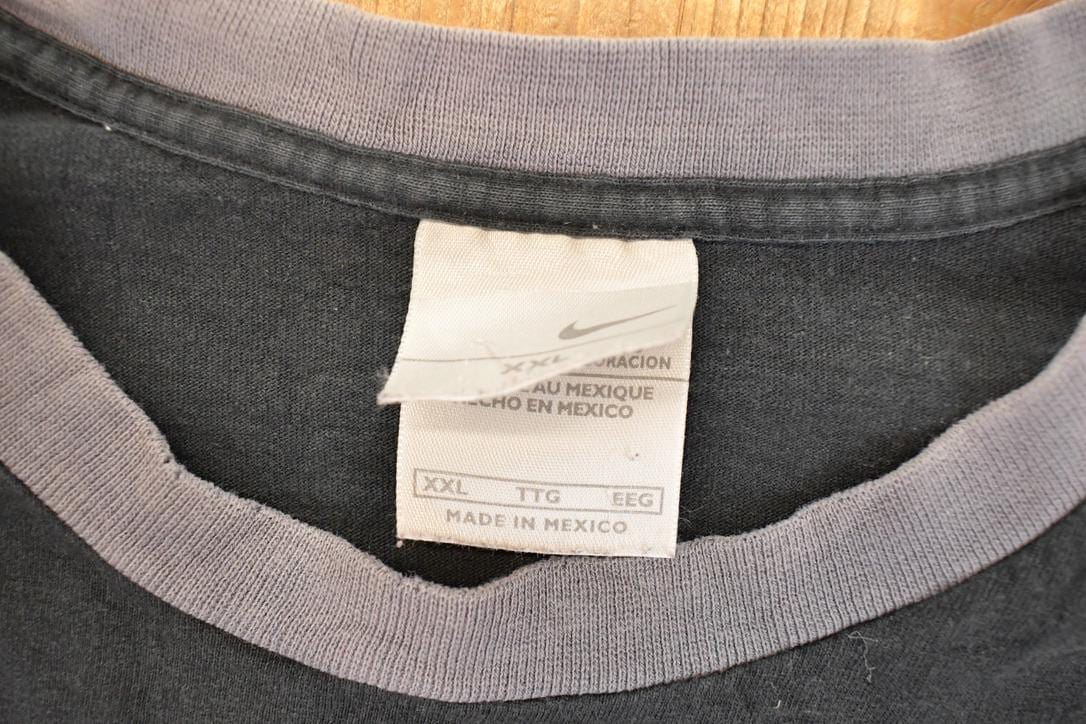 Vintage 1990s Nike Embroidered Mini Swoosh Shirt Men's XL from propervintagecanada