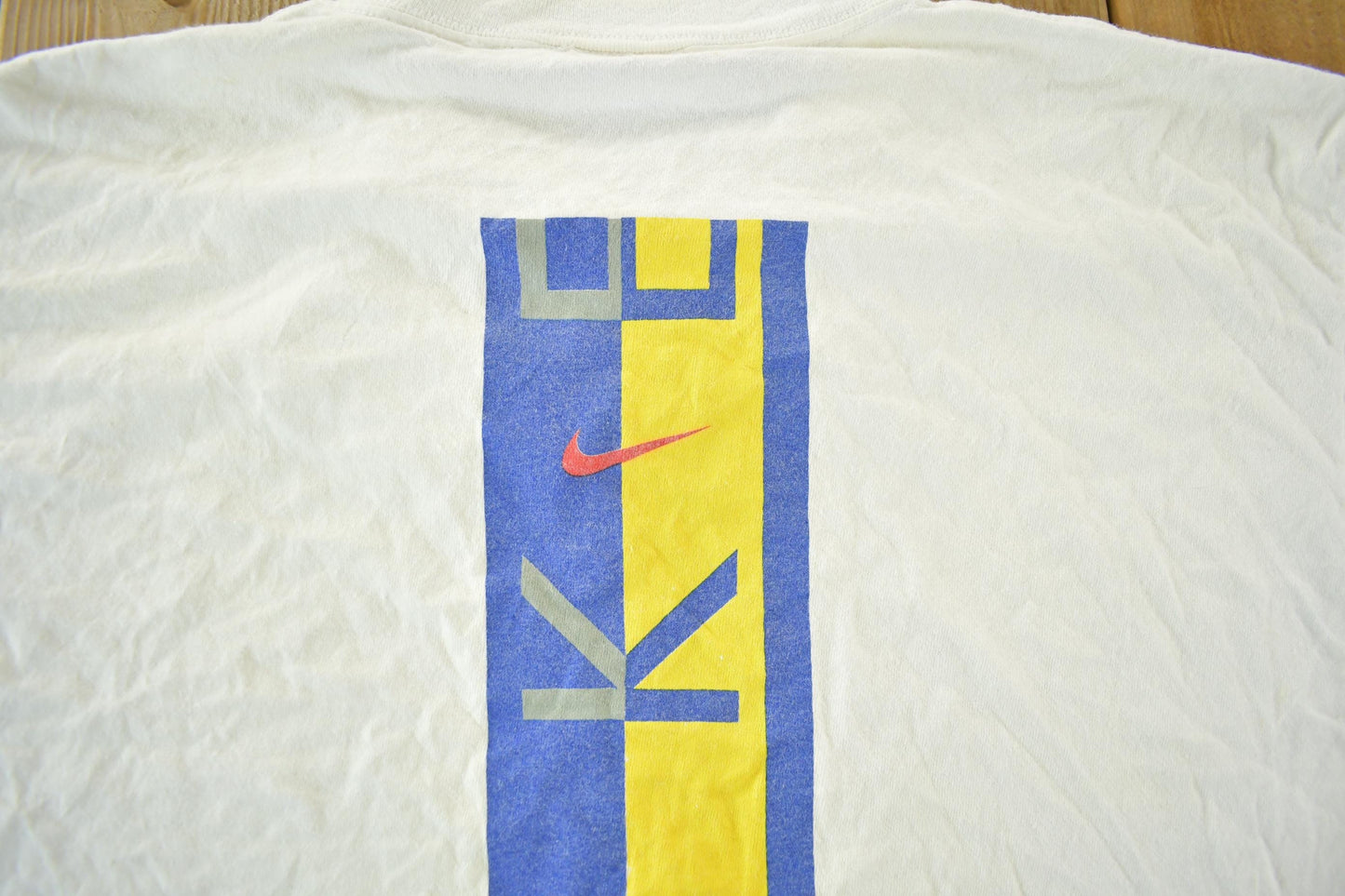 Vintage 1990s Nike Graphic T-Shirt Men's Large from propervintagecanada