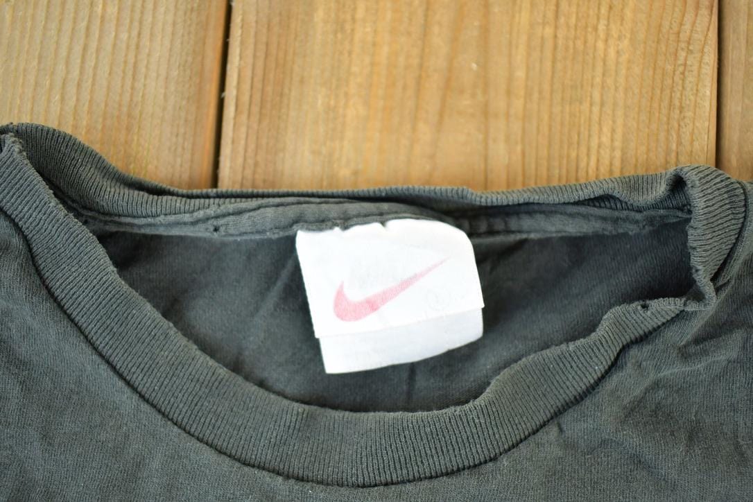 Vintage 1990s Nike Graphic T-Shirt Men's Medium from propervintagecanada