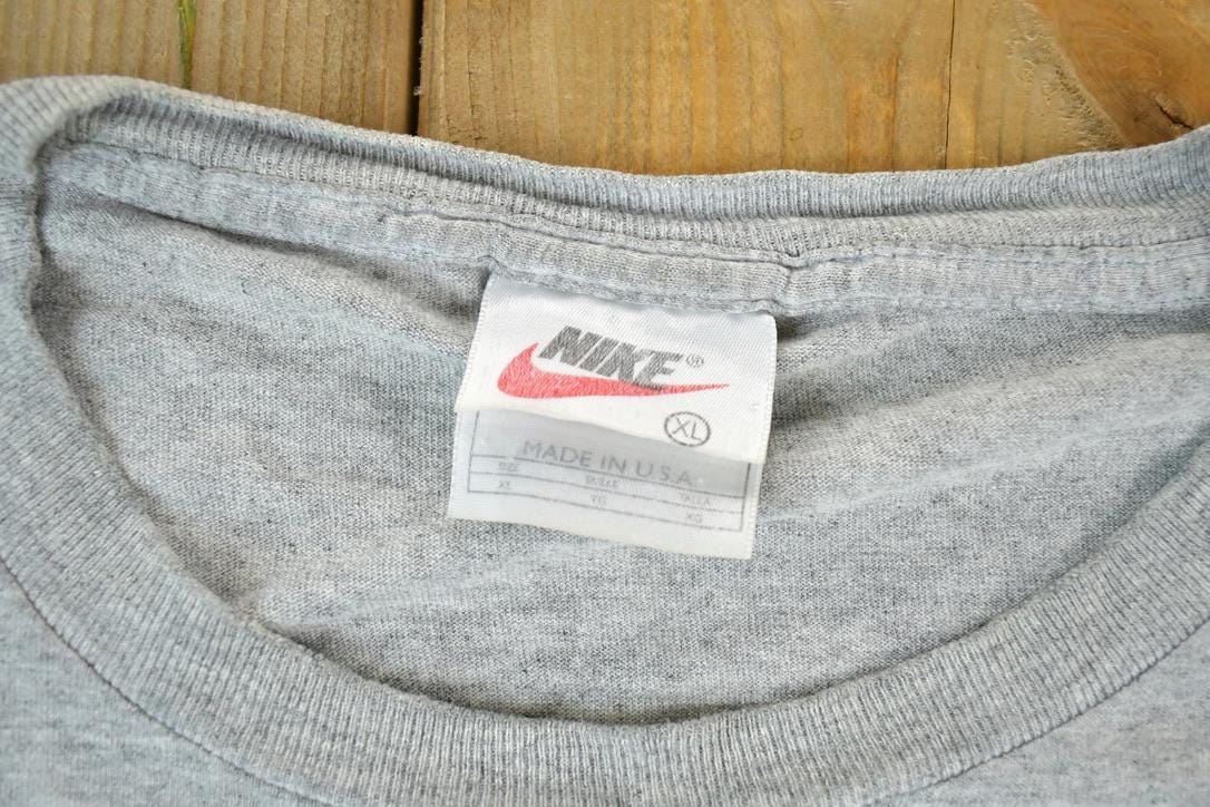 Vintage 1990s Nike Graphic T-Shirt Men's XL from propervintagecanada