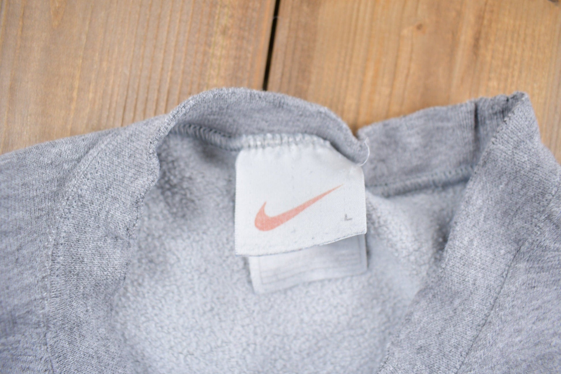 Vintage 1990s Nike Heather Grey Mini Swoosh Crewneck Sweatshirt Men's L from propervintagecanada