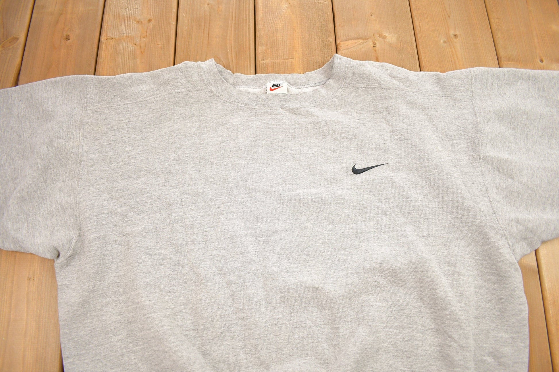 Vintage 1990s Nike Heather Grey Mini Swoosh Crewneck Sweatshirt Men's XL from propervintagecanada