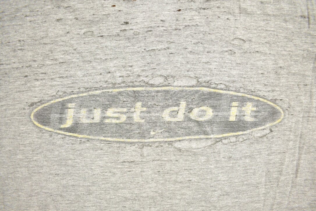 Vintage 1990s Nike Logo Slogan Graphic T-Shirt Men's XL from propervintagecanada