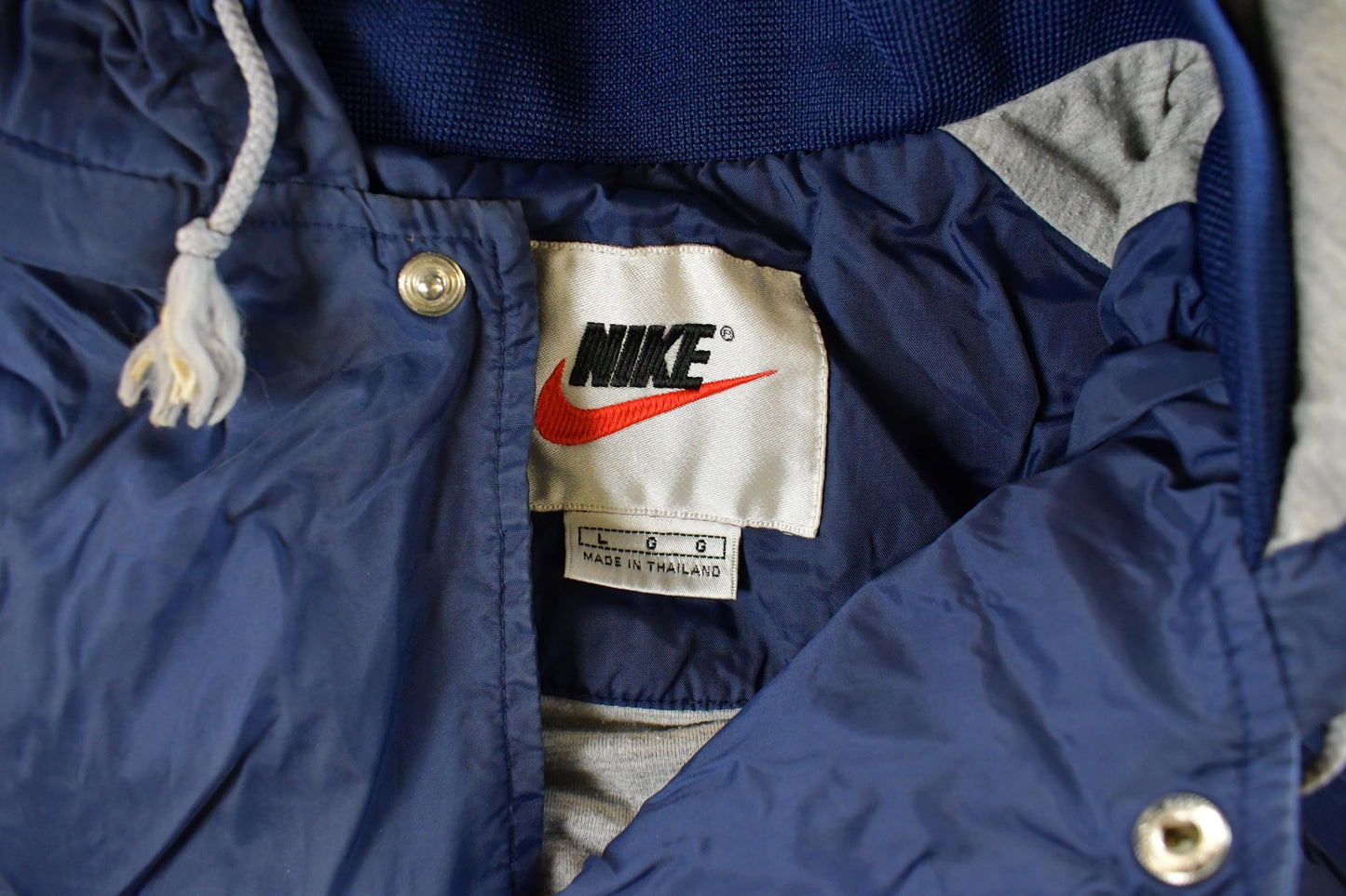 Vintage 1990s Nike Mini Swoosh Hooded Windbreaker Jacket Men's Large from propervintagecanada