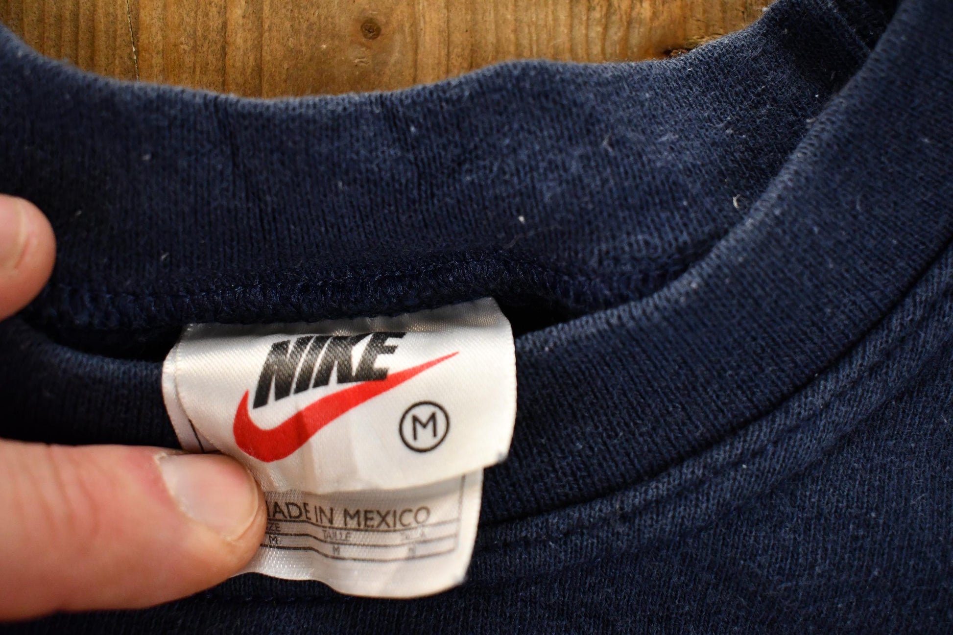 Vintage 1990s Nike Mini Swoosh Navy Crewneck Sweatshirt Men's M from propervintagecanada