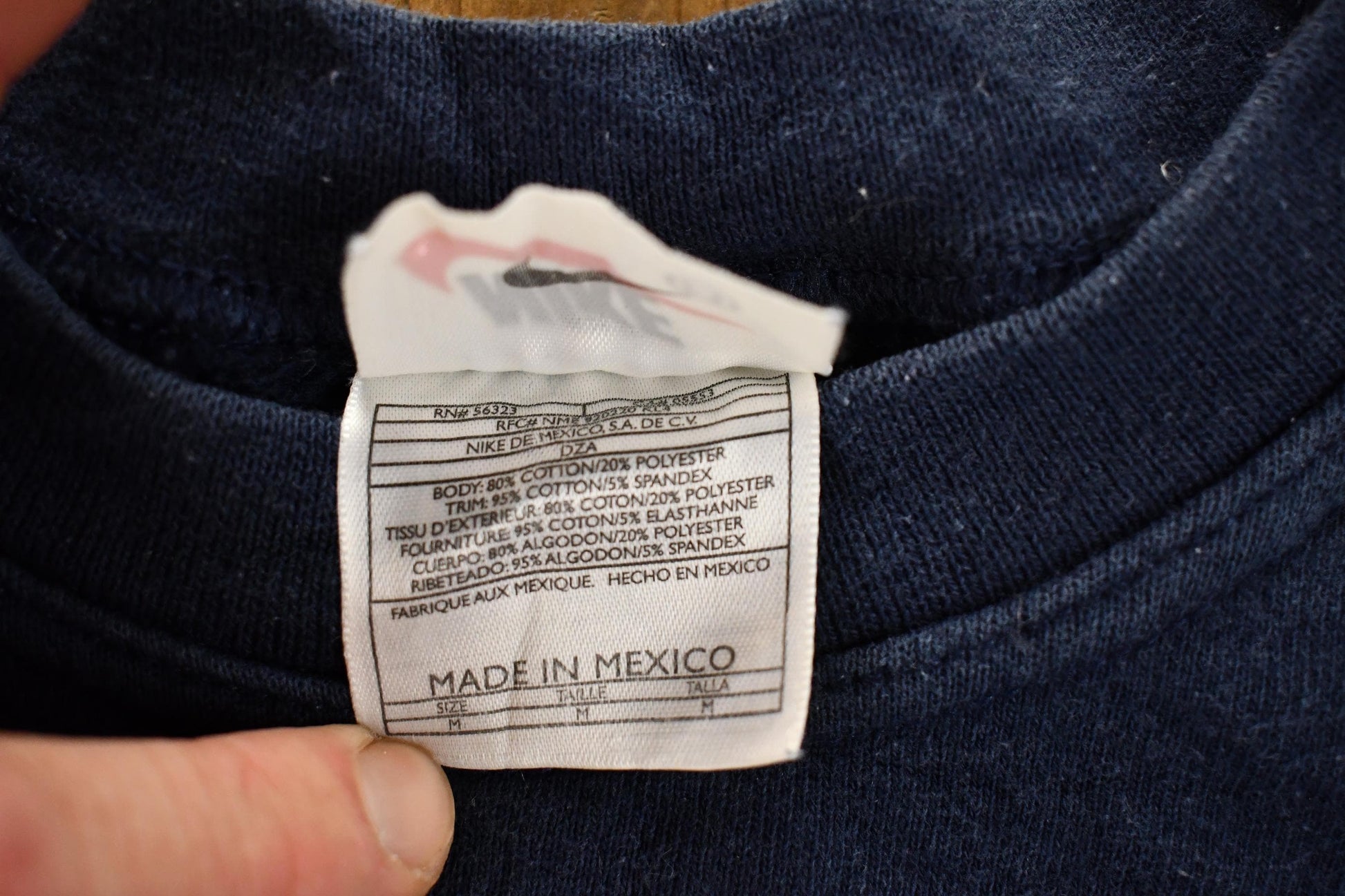 Vintage 1990s Nike Mini Swoosh Navy Crewneck Sweatshirt Men's M from propervintagecanada