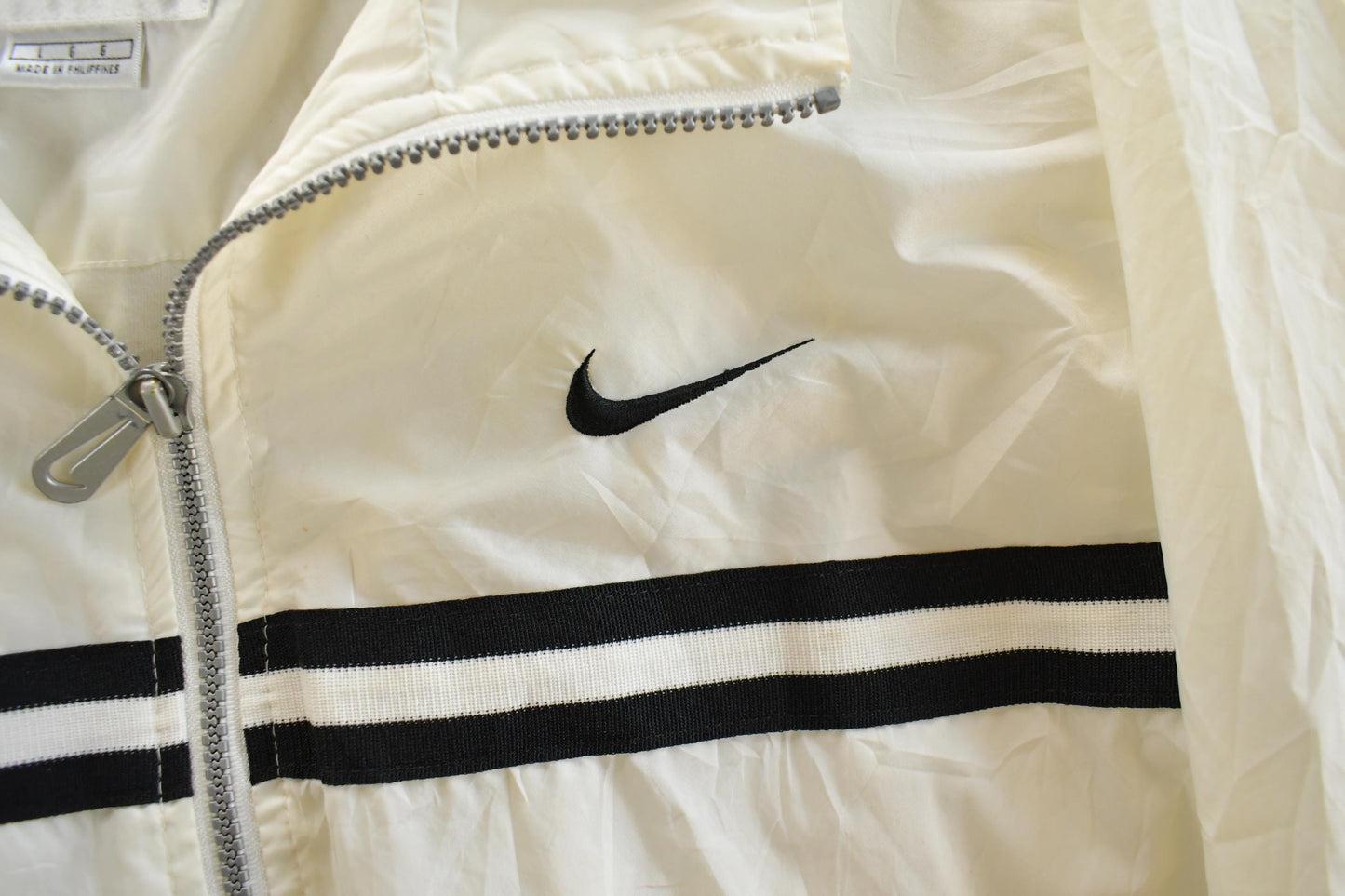Vintage 1990s Nike Mini Swoosh Windbreaker Jacket Men's Large from propervintagecanada