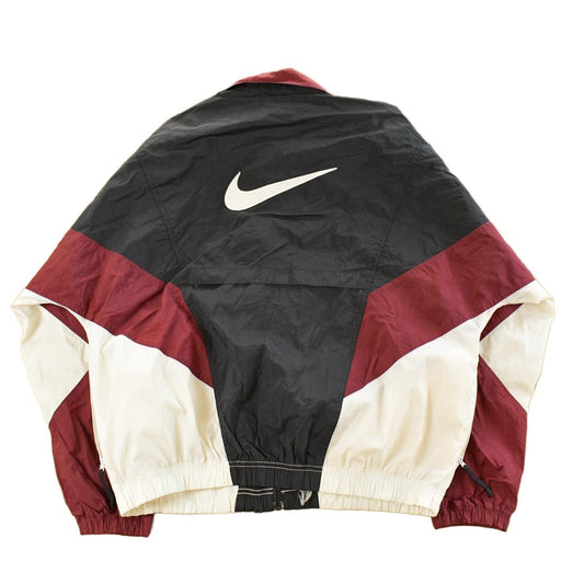 Vintage 1990s Nike Mini Swoosh Windbreaker Jacket Men's Medium from propervintagecanada