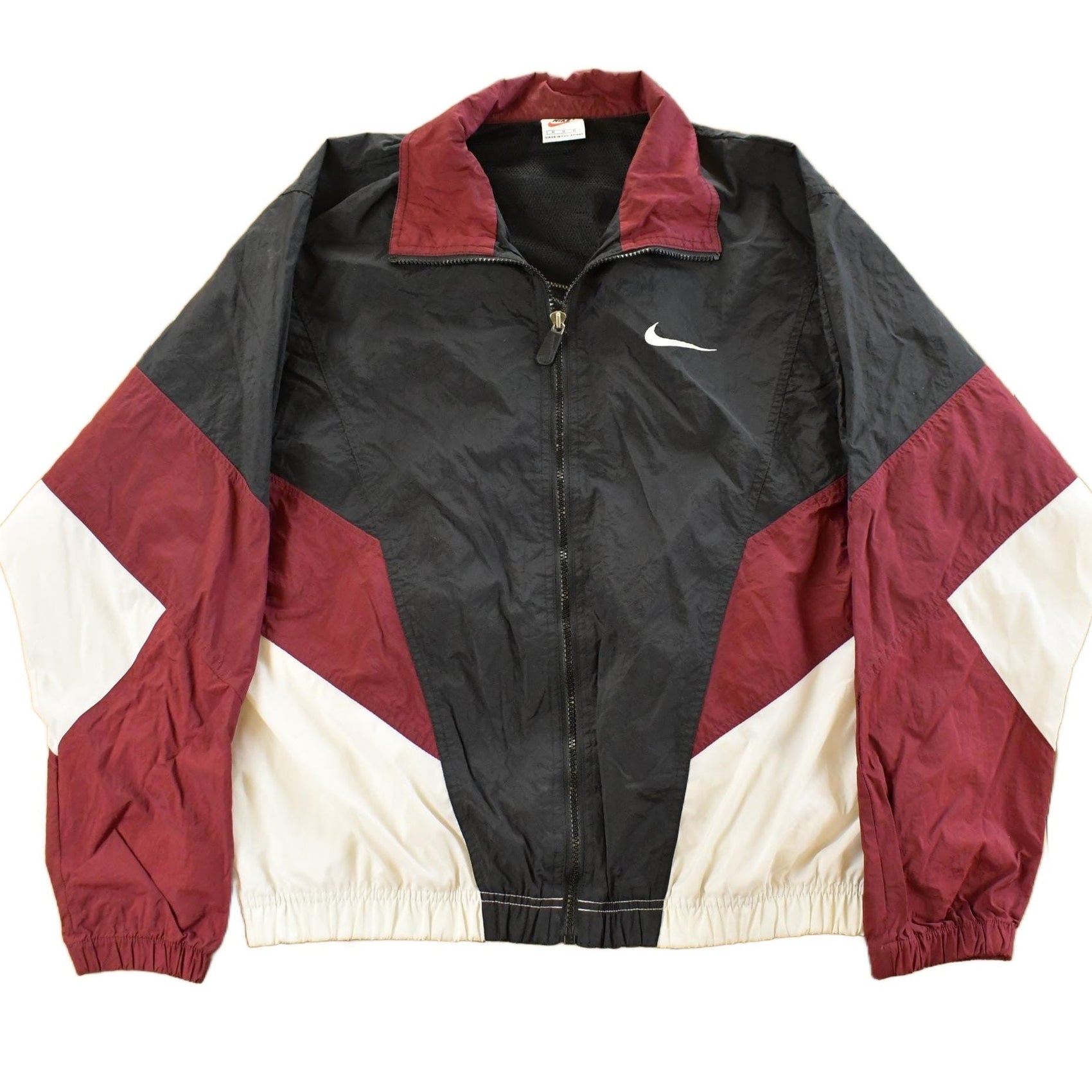 Vintage 1990s Nike Mini Swoosh Windbreaker Jacket Men's Medium from propervintagecanada