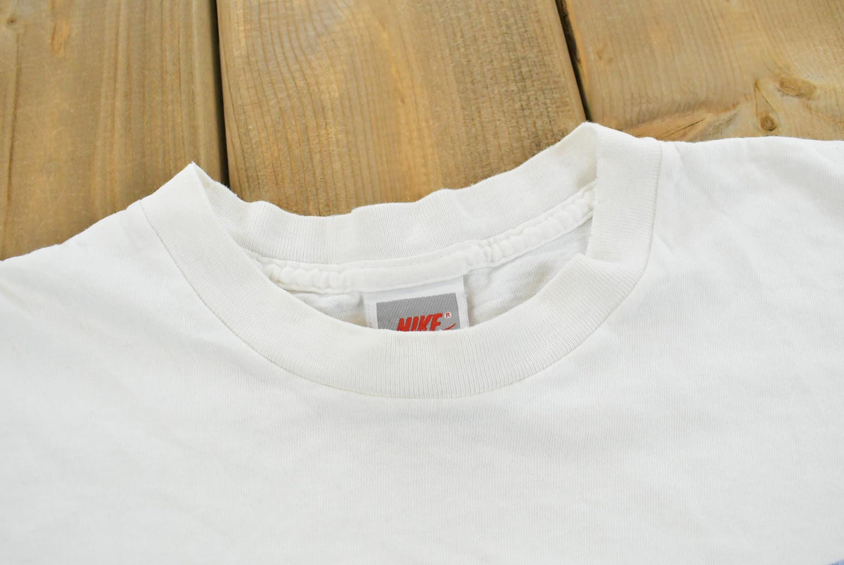 Vintage 1990s Nike Swoosh Graphic T-Shirt Men's L from propervintagecanada