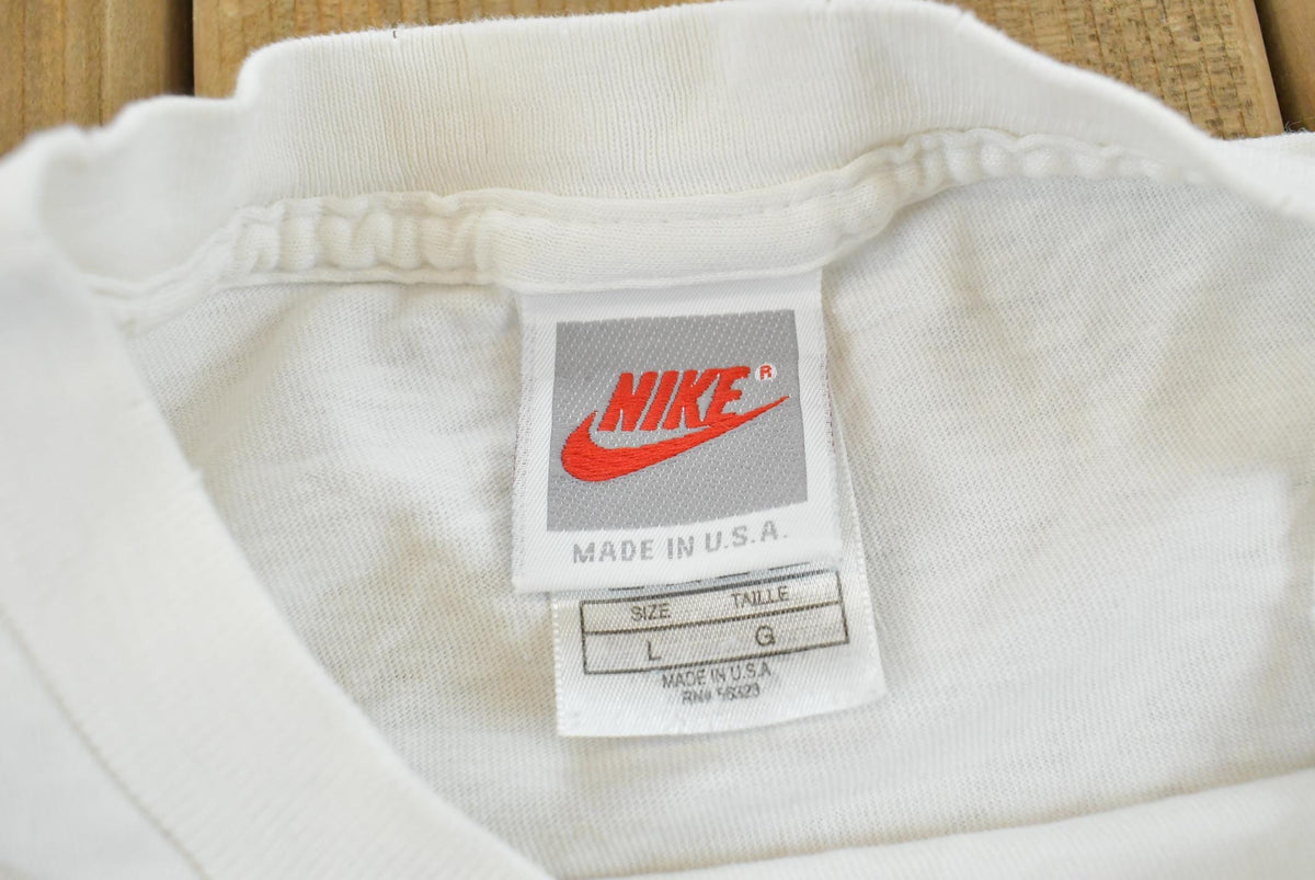 Vintage 1990s Nike Swoosh Graphic T-Shirt Men's L from propervintagecanada