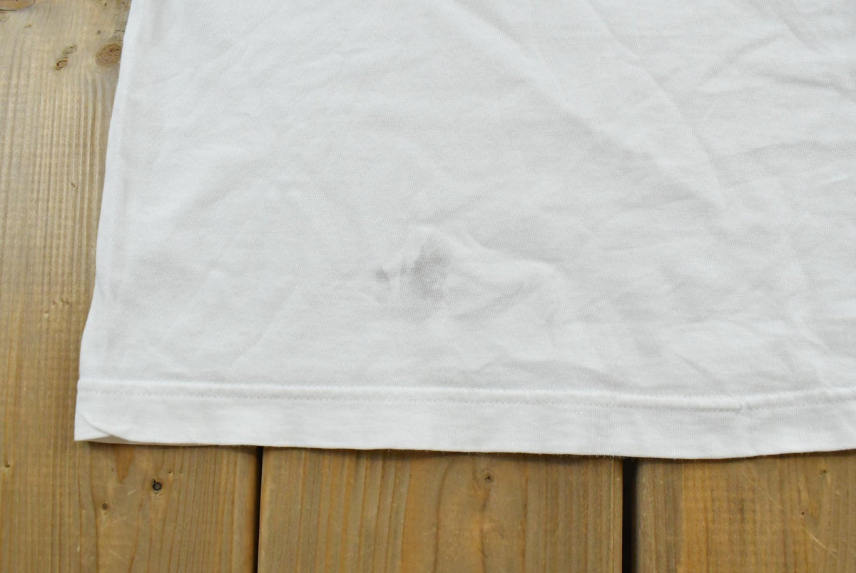 Vintage 1990s Nike Swoosh Graphic T-Shirt Men's L from propervintagecanada