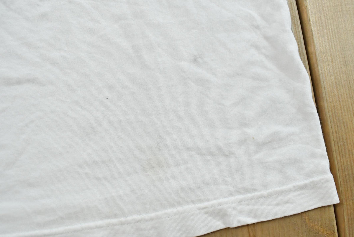 Vintage 1990s Nike Swoosh Graphic T-Shirt Men's L from propervintagecanada