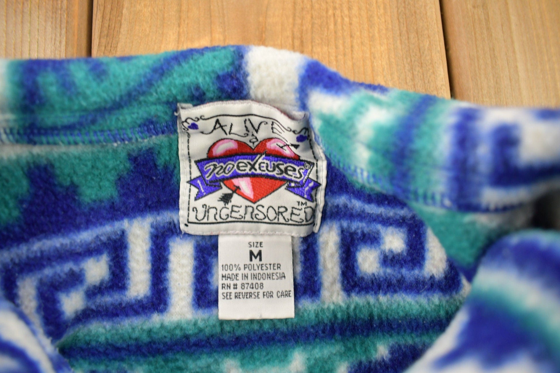 Vintage 1990s No Excuses Aztec Graphic Fleece Sweater from propervintagecanada