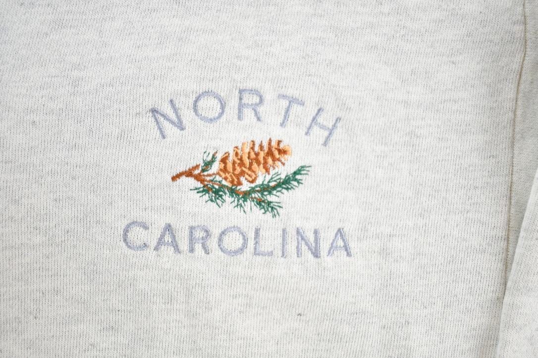 Vintage 1990s North Carolina Souvenir Quarter Button Crewneck Sweatshirt Made In USA Men's Small from propervintagecanada