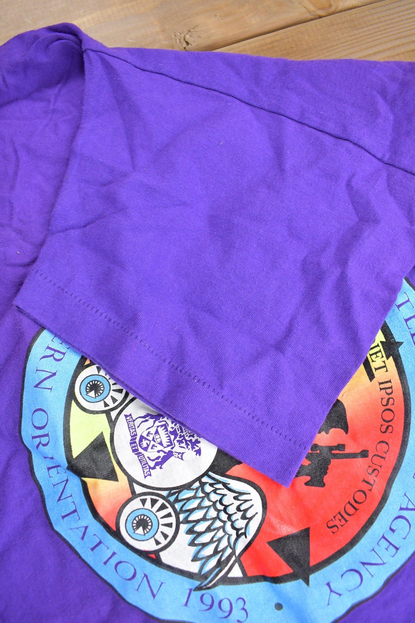 Vintage 1990s Off Campus International Agency Western Orientation Graphic T Shirt Men's XL from propervintagecanada
