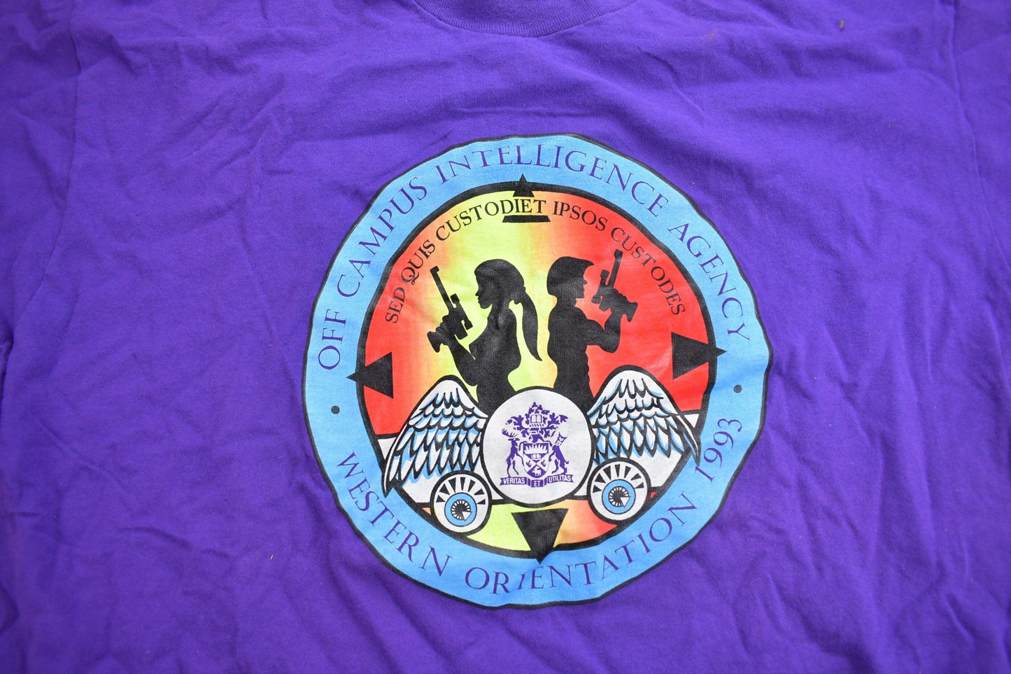 Vintage 1990s Off Campus International Agency Western Orientation Graphic T Shirt Men's XL from propervintagecanada