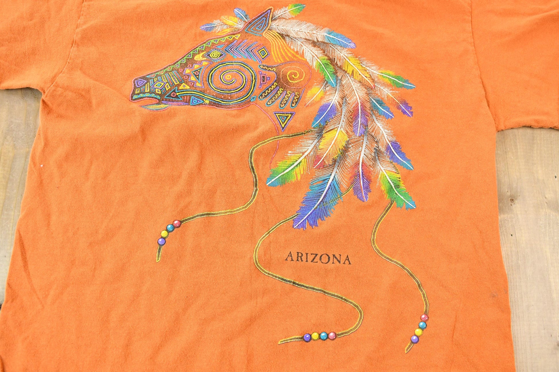 Vintage 1990s Orange Souvenir Arizona USA Feather and Bead Horse Travel T-Shirt Men's Small from propervintagecanada