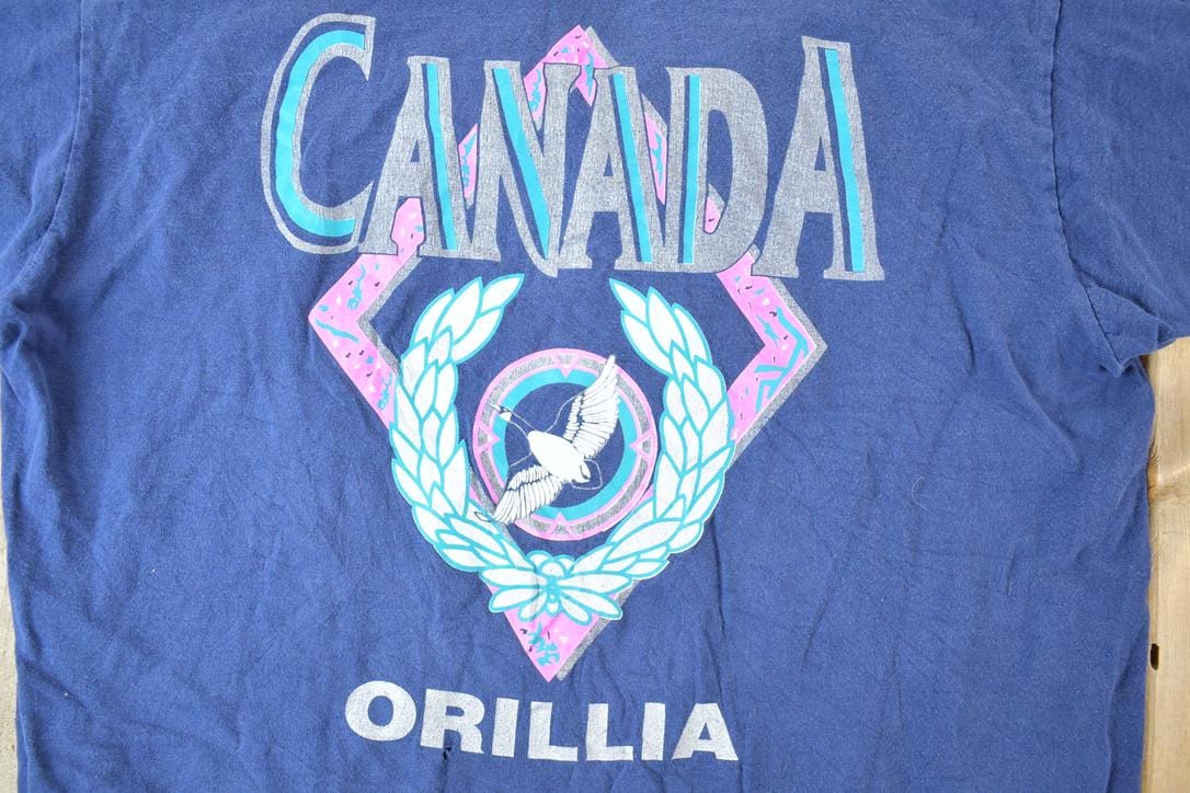 Vintage 1990s Orillia Canada Souvenir Single Stitch Graphic Print T-Shirt Made In Canada Men's XL from propervintagecanada