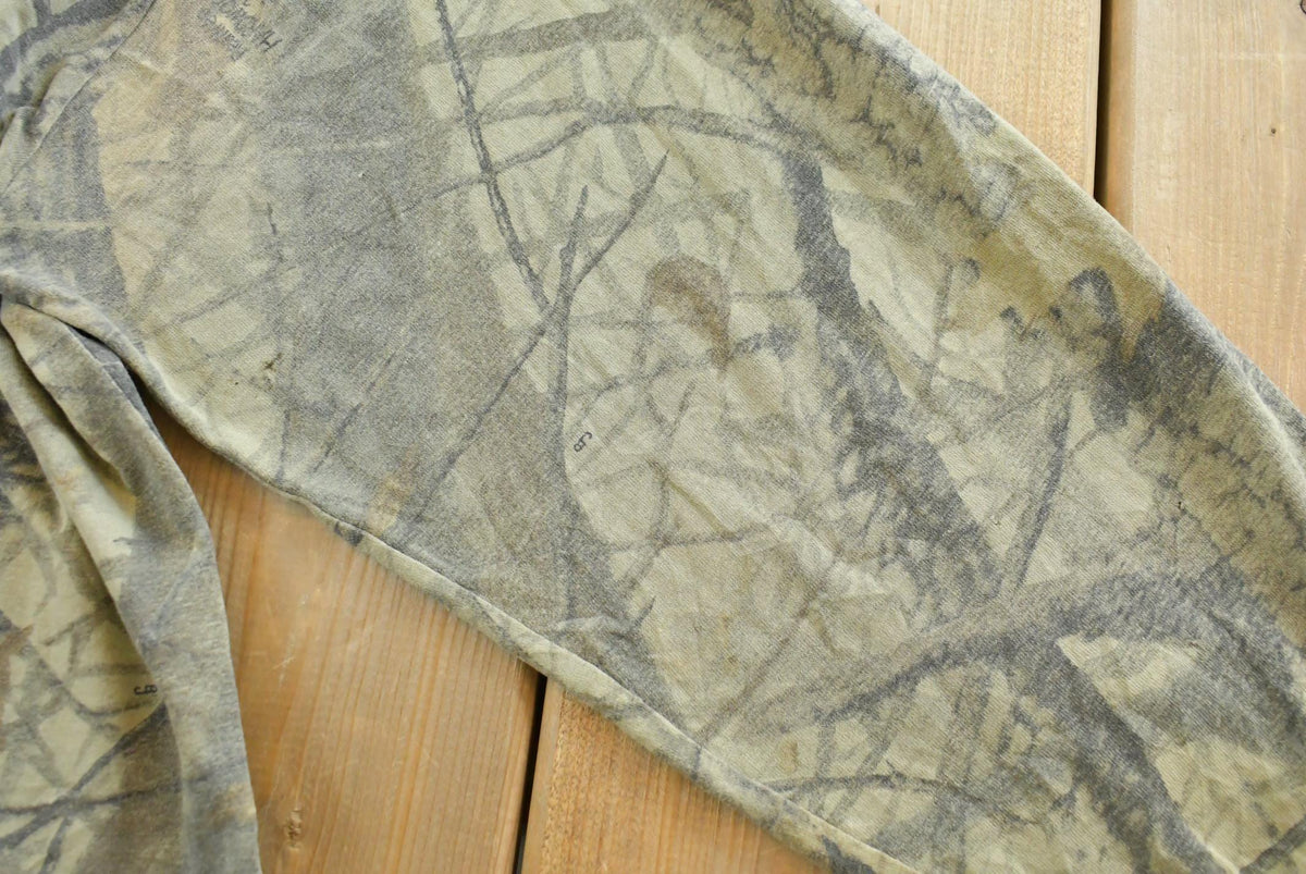 Vintage 1990s Outdoors RealTree Hardwoods Camo Long Sleeve T-Shirt Men's XL from propervintagecanada